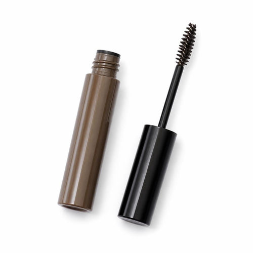 Tinted brow gel tube with spoolie wand beside it