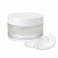 Jar of hydrogel under-eye patches with two patches beside it